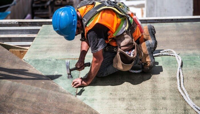 Commercial roofer at work — profitable commercial roof repair business for sale with seller financing