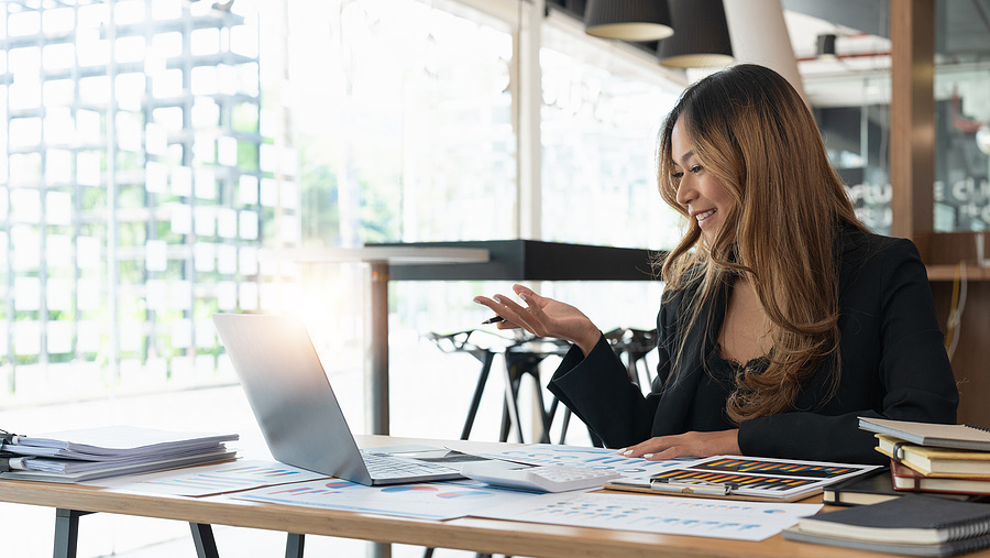 Businesswoman smiling during a video call at her laptop