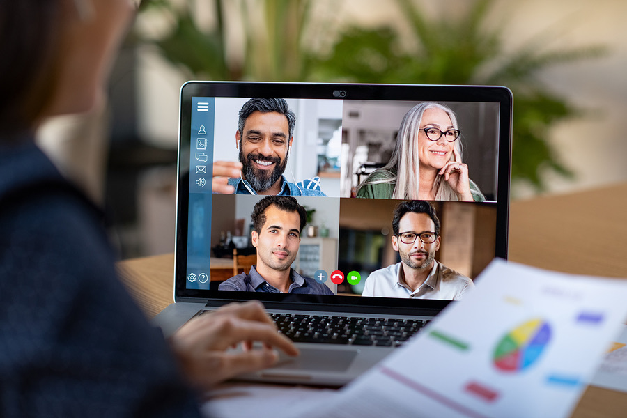 Woman on a video call with four colleagues on her laptop