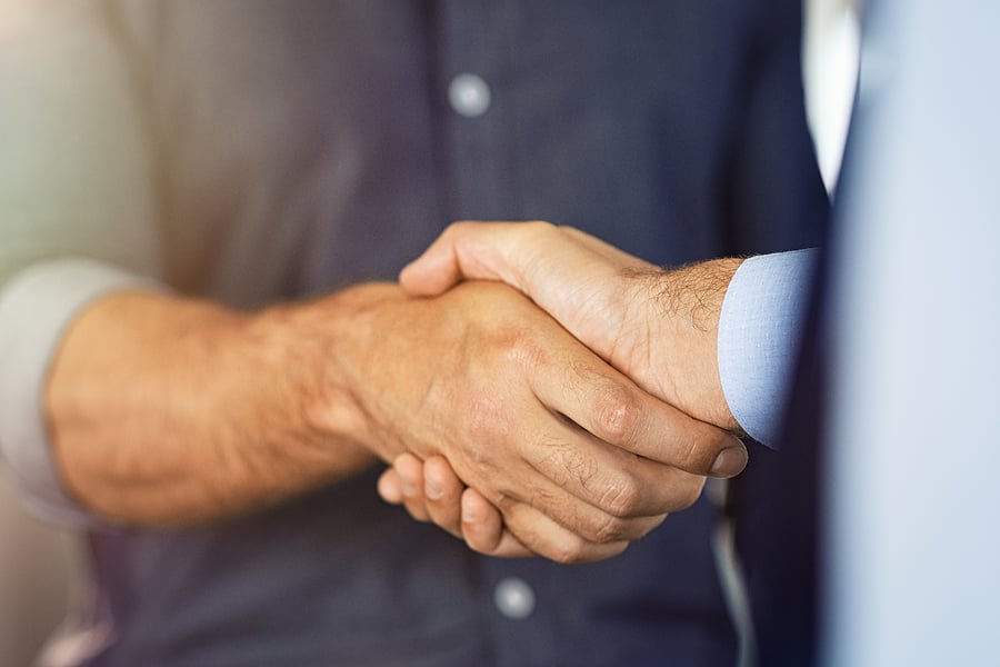 Close-up handshake between two businessmen