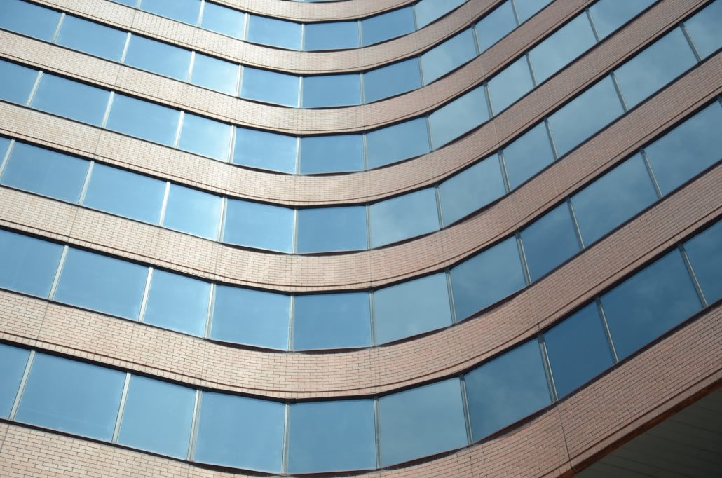 Curved glass facade of a modern office building