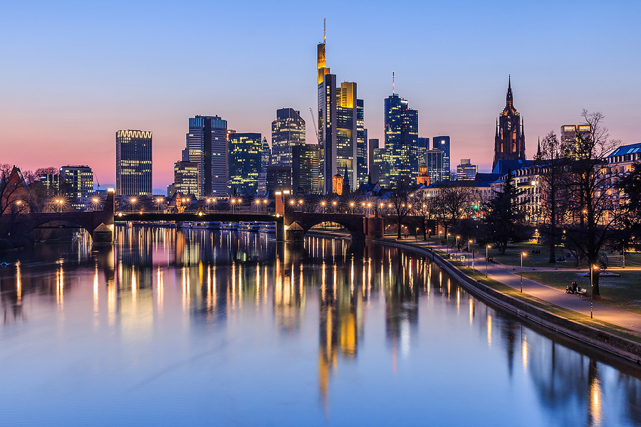 City skyline reflected in a river at dusk