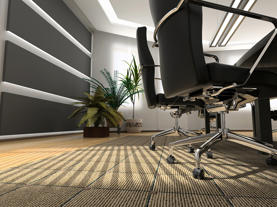 Empty conference room with leather chairs and a potted plant