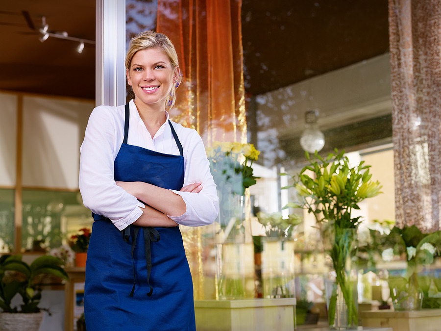 Small business owner standing in her flower shop
